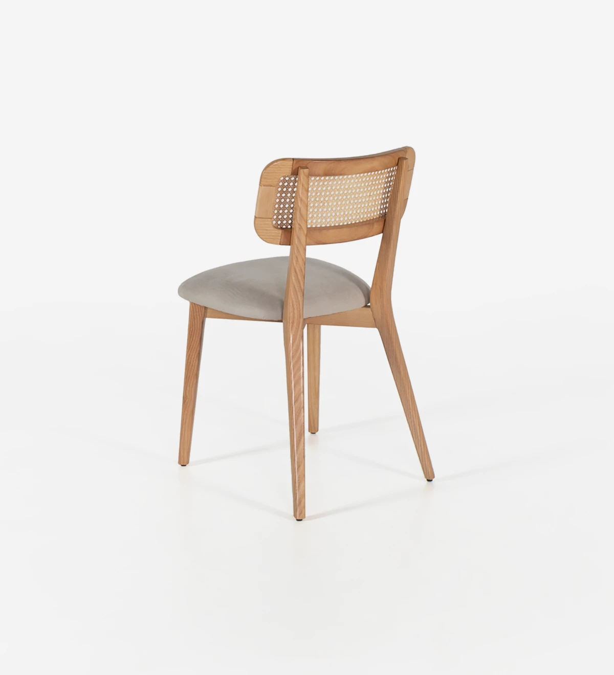 Wood chair, with rattan detail on the back and fabric upholstered seat.