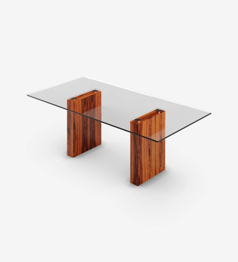 Table de repas rectangulaire avec plateau en verre, pieds en palissandre brillant.