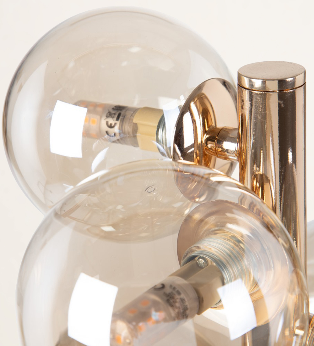 Table lamp in gold metal and glass