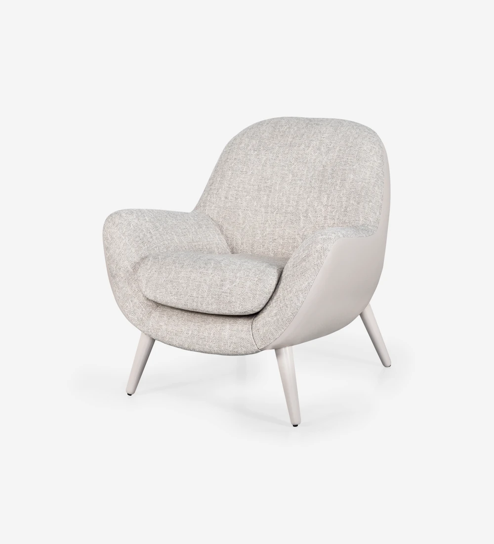 Armchair upholstered in fabric, with pearl lacquered legs.
