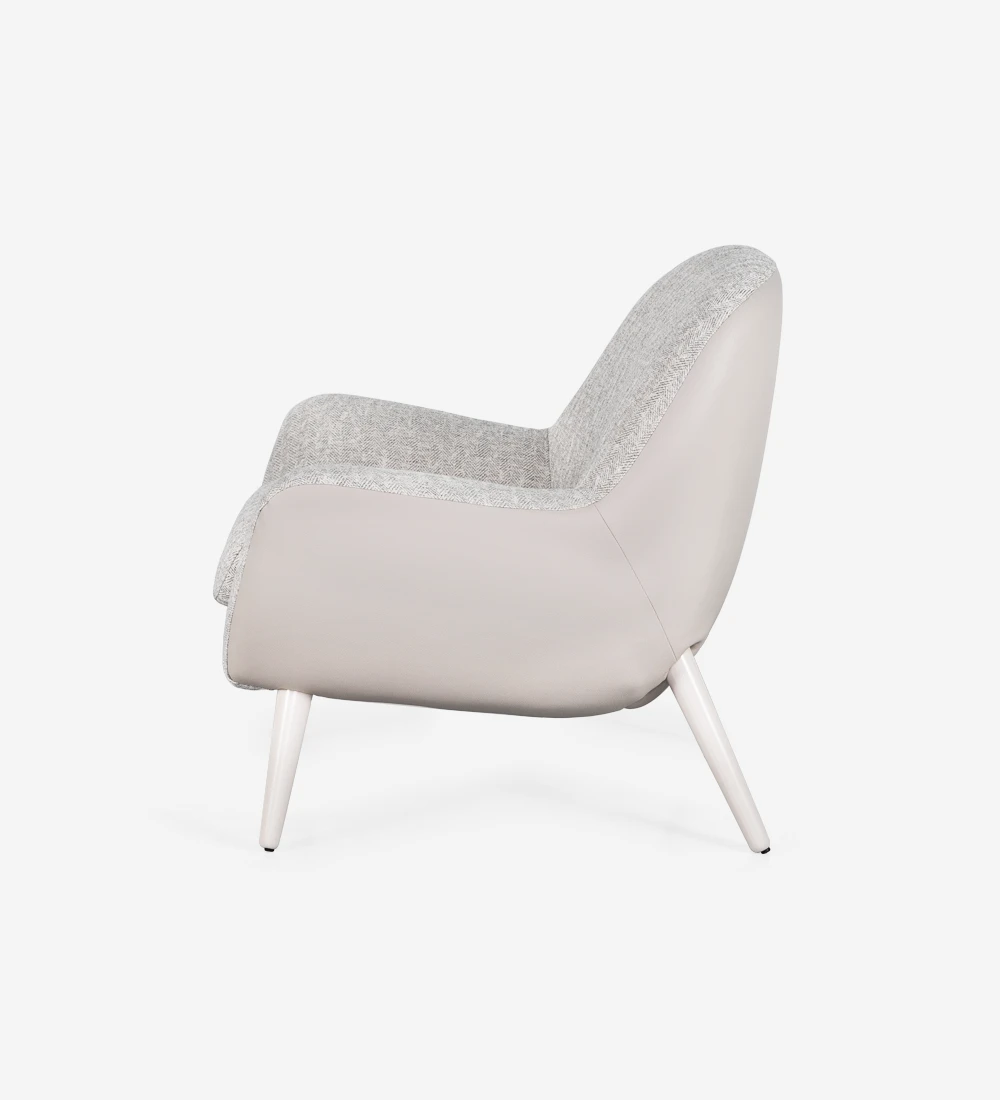 Armchair upholstered in fabric, with pearl lacquered legs.