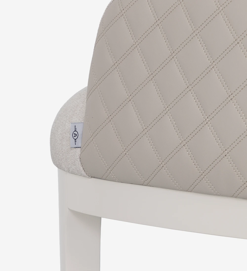 Chair with armrest upholstered in fabric, with pearl lacquered feet.