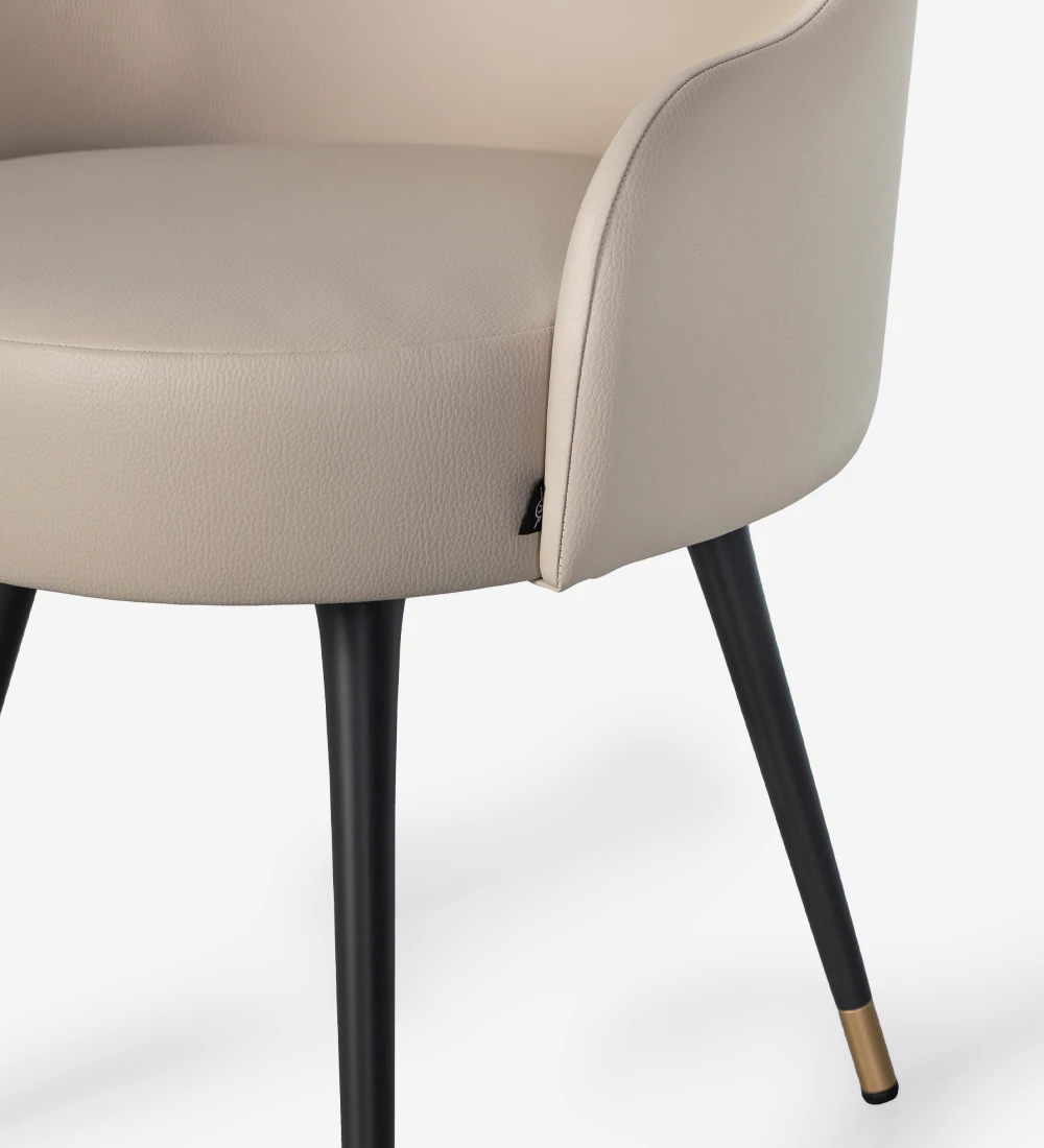 Fabric upholstered swivel chair with black lacquered legs and gold detailing.