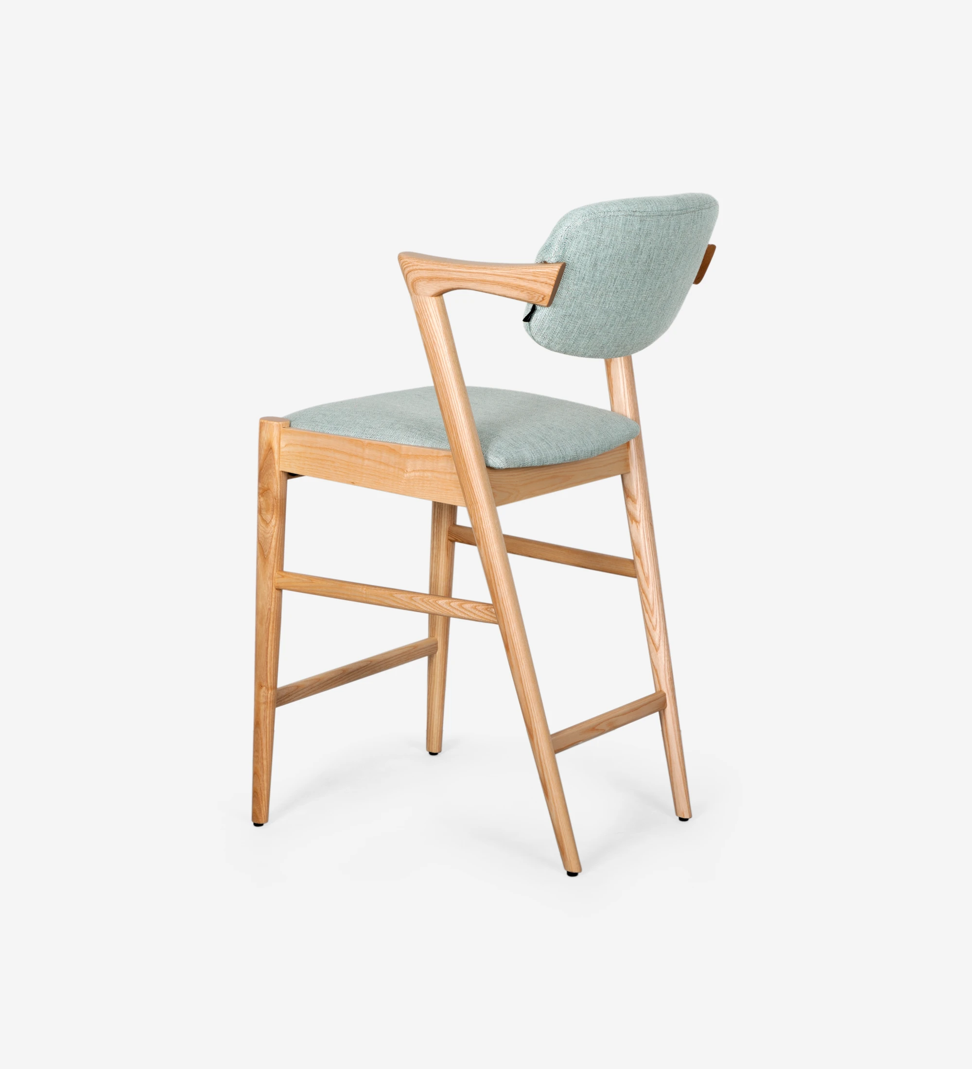 Stool in natural colored ash wood, with seat and back upholstered in fabric.