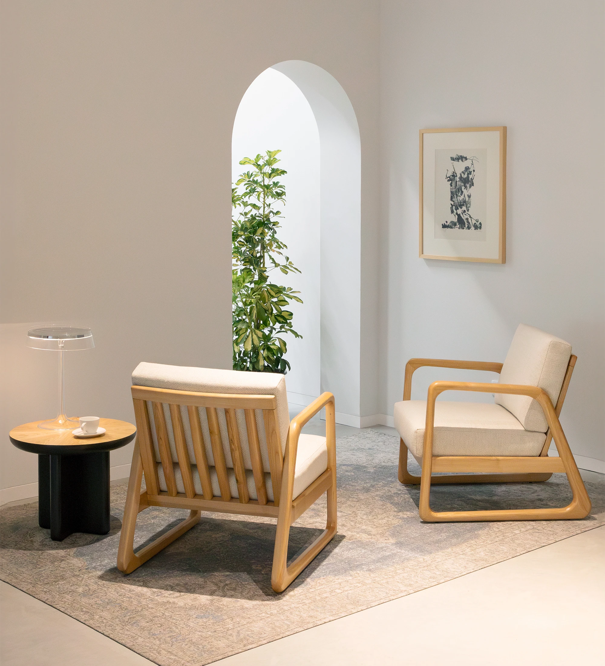 Antarte by AI Armchair upholstered in beige fabric, structure in natural wood.