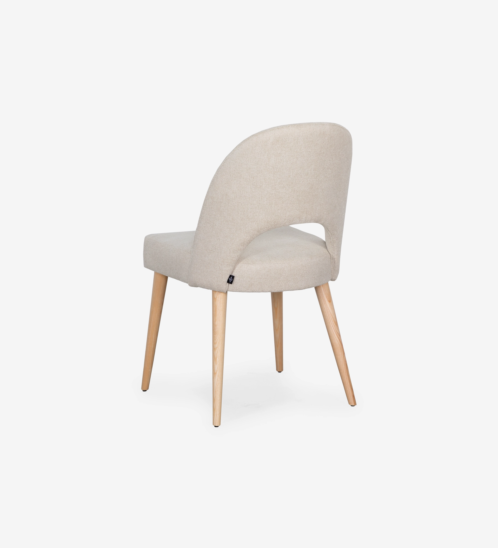 Chair upholstered in beige fabric, with natural colored wooden legs.