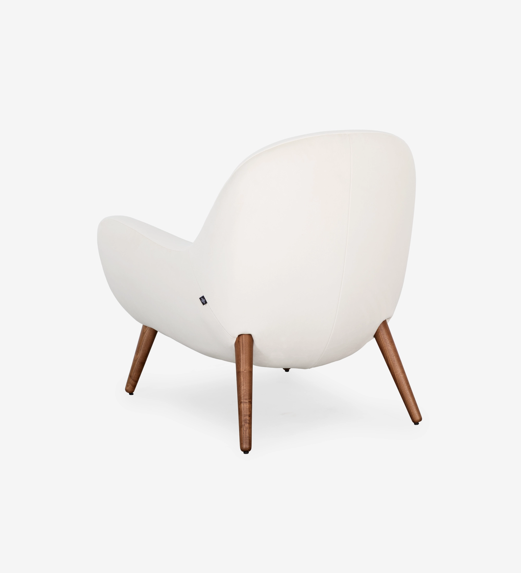 Oslo armchair upholstered in pearl fabric with walnut-stained ash wood legs.
