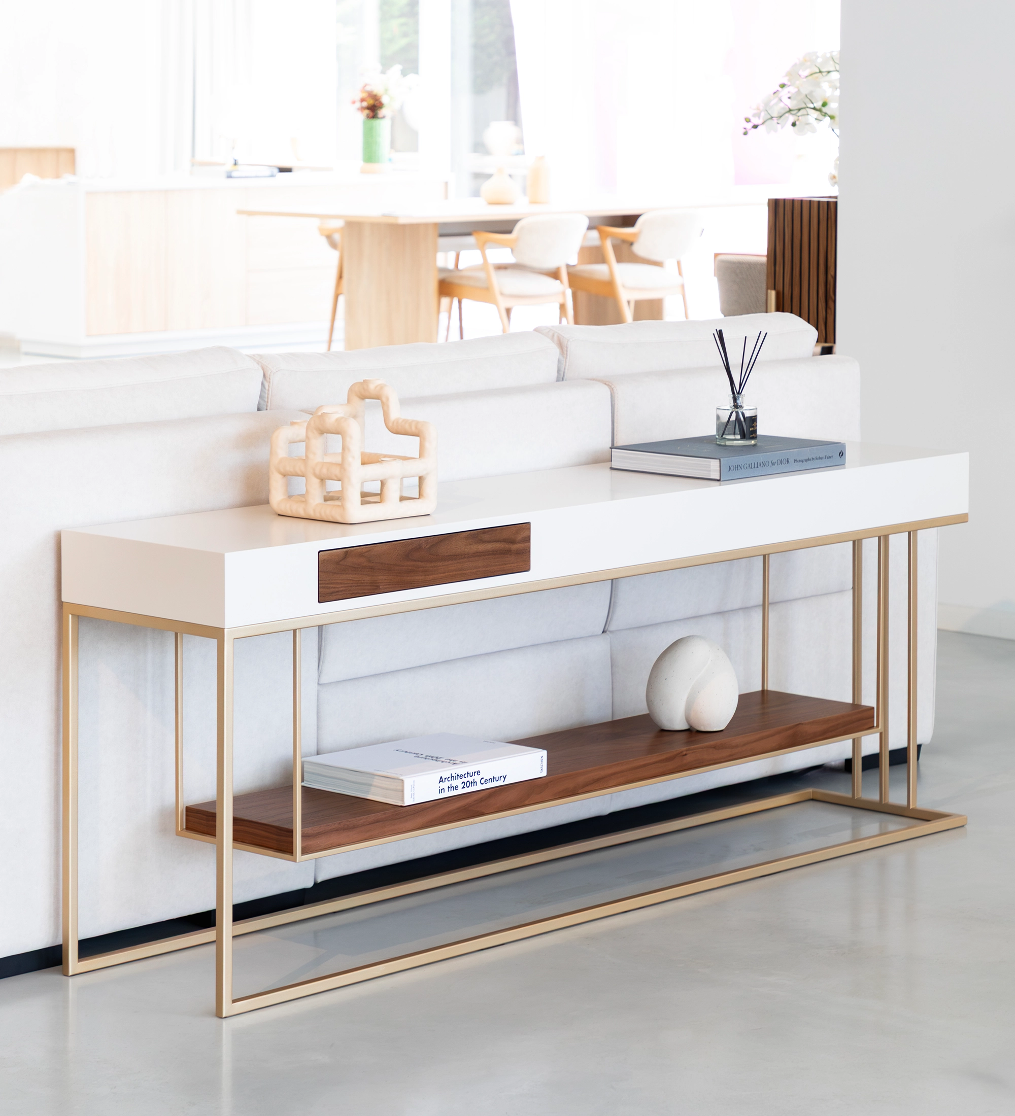 Double-sided console, with drawer on each side and natural walnut shelf, pearl lacquered structure and golden lacquered metal foot.