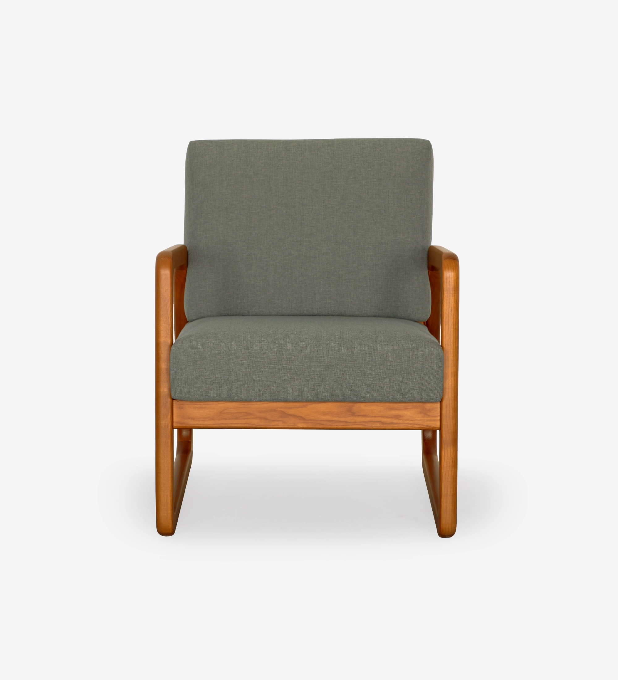 Sillón Antarte by IA tapizado en tela verde, estructura en madera color miel.