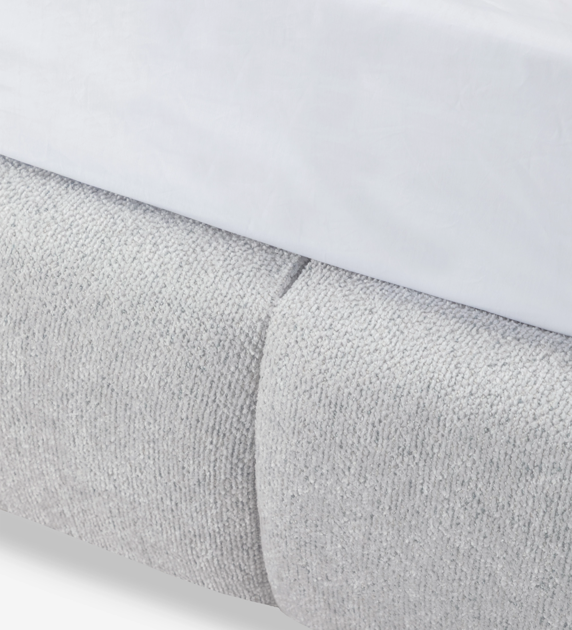 Double bed with short headboard, upholstered in grey fabric.