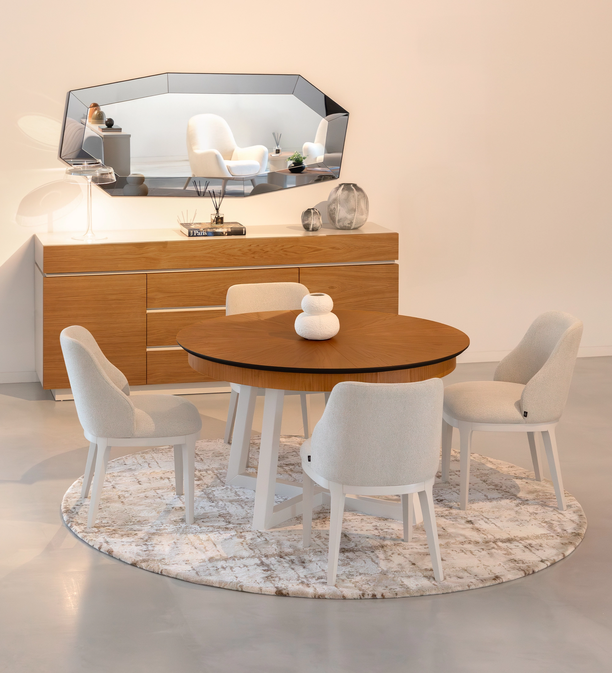 Round extendable dining table with honey oak top and pearl lacquered legs.