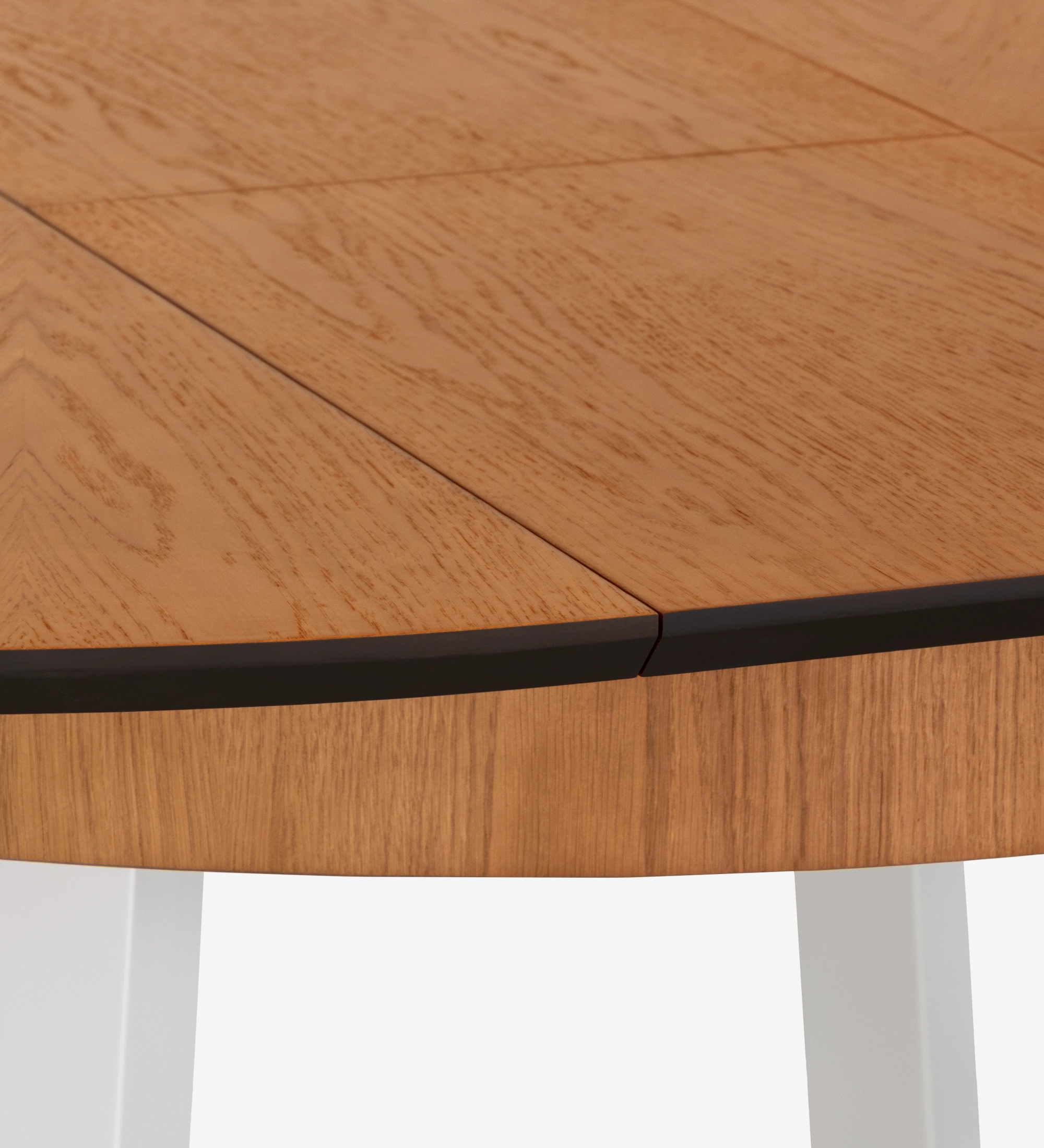 Round extendable dining table with honey oak top and pearl lacquered legs.