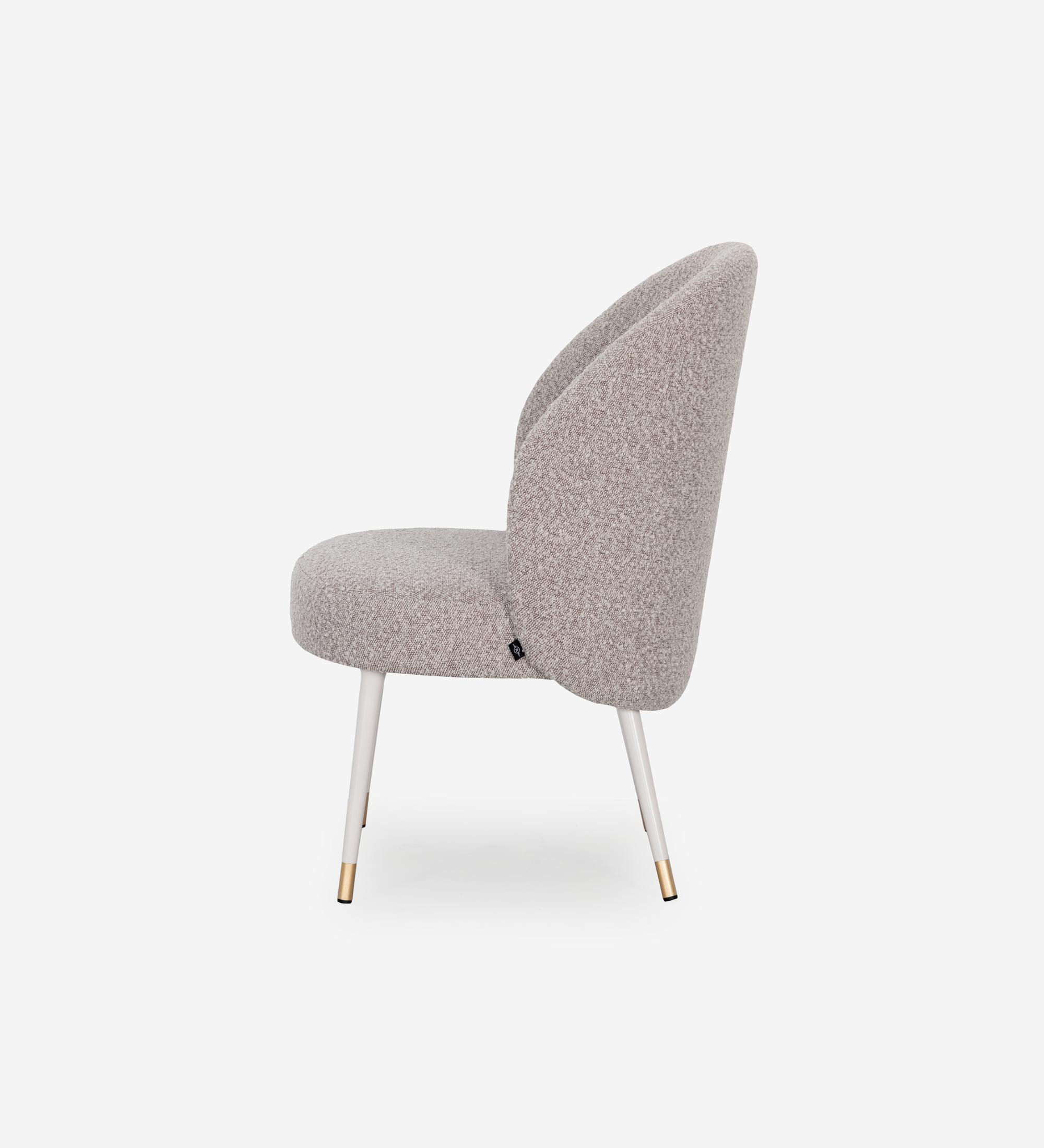 Geneve armchair upholstered in toffee fabric, pearl lacquered feet and golden detail.