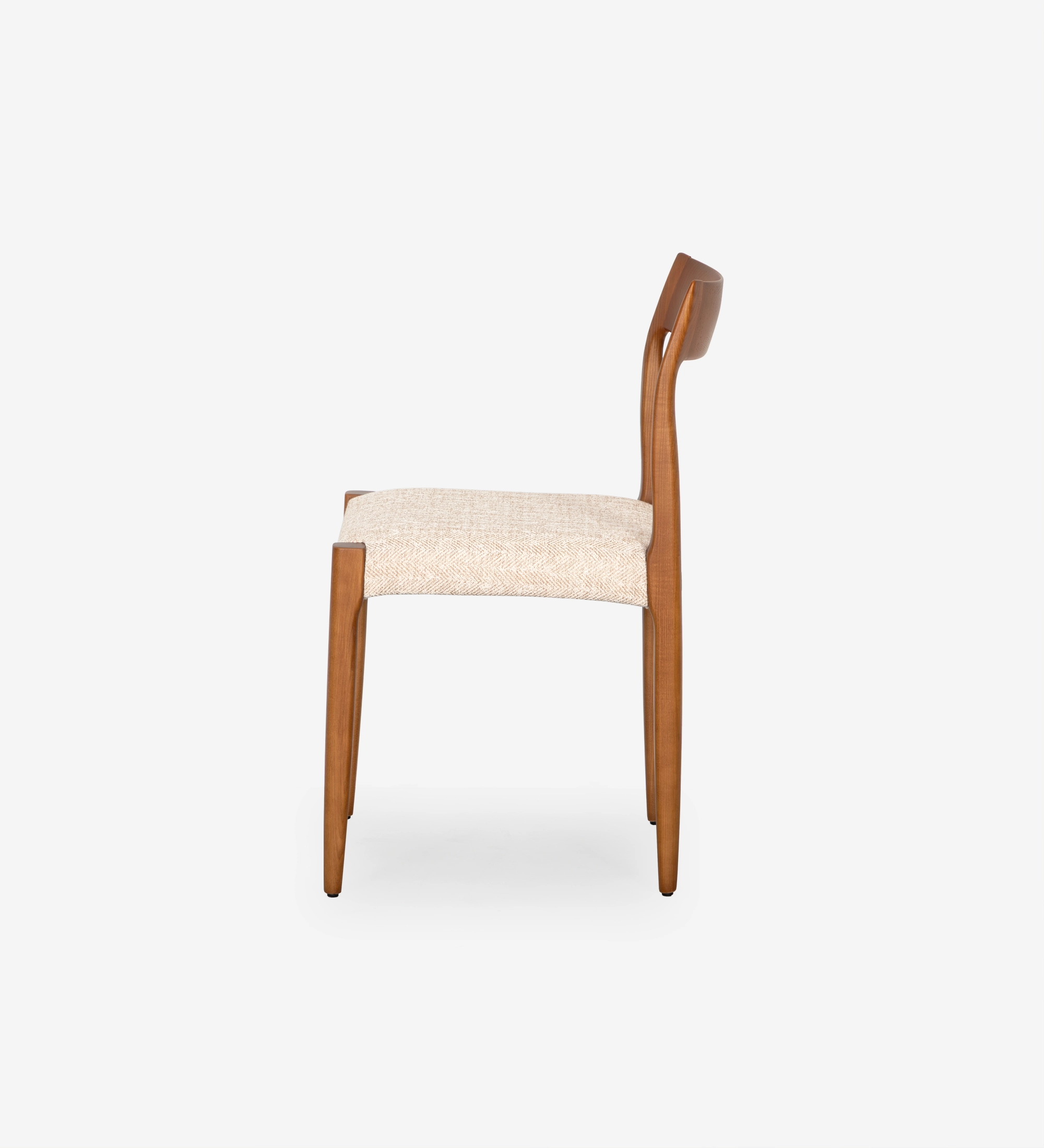 Chair in honey colored ash wood with beige fabric upholstered seat.