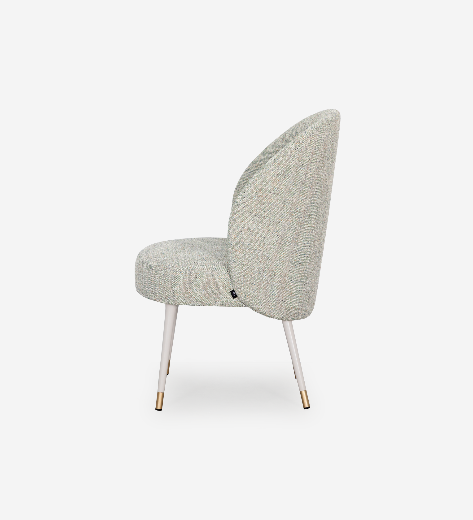 Geneve armchair upholstered in green fabric, pearl lacquered feet and golden detail.