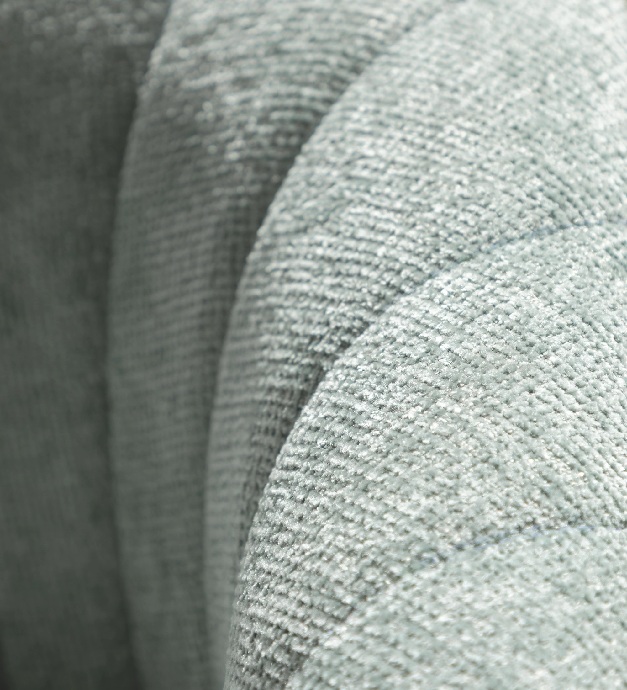 Tokyo armchair upholstered in aqua green fabric, black lacquered legs.