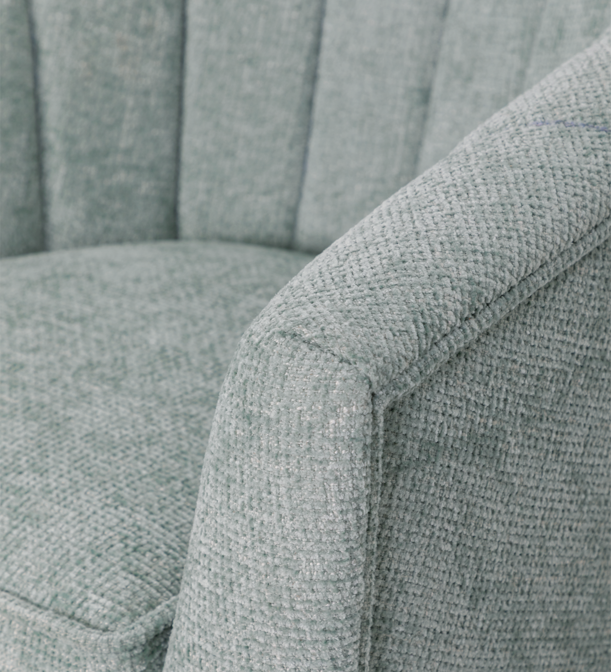 Tokyo armchair upholstered in aqua green fabric, black lacquered legs.