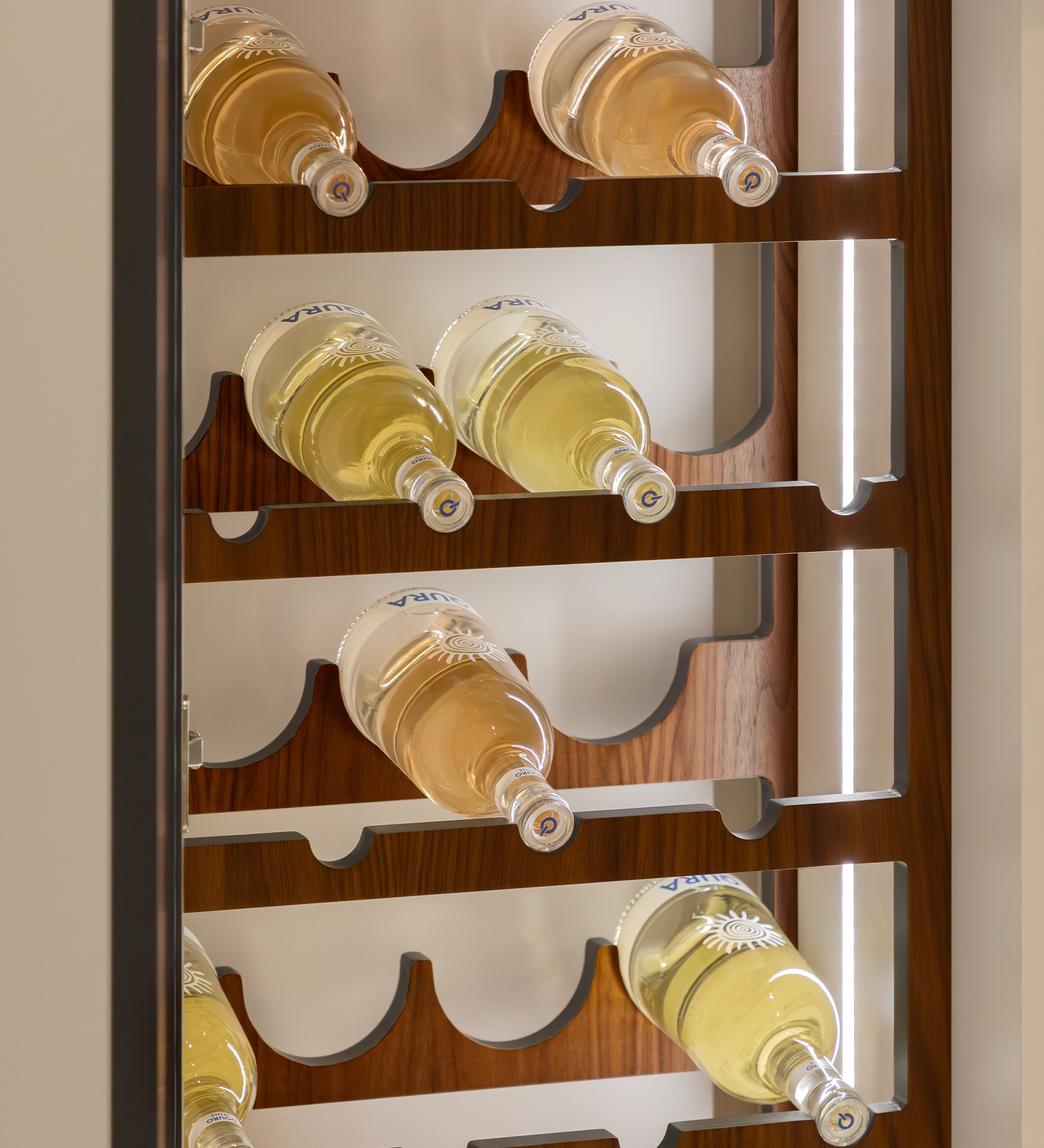 Cannes Wine Cellar wooden vertical rack holding horizontal white wine bottles