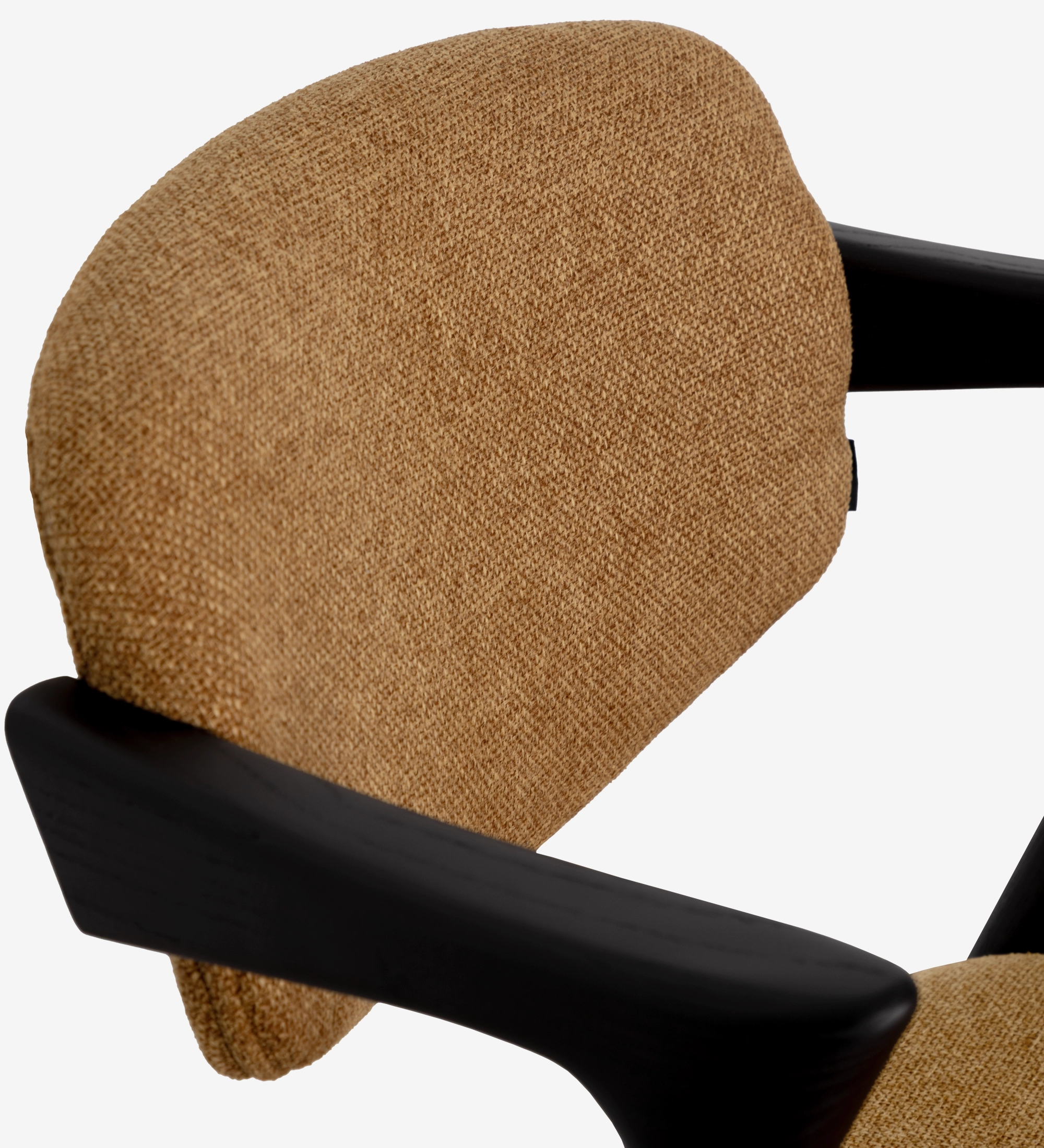 Elba Chair close-up of tan textured backrest and black wooden armrest