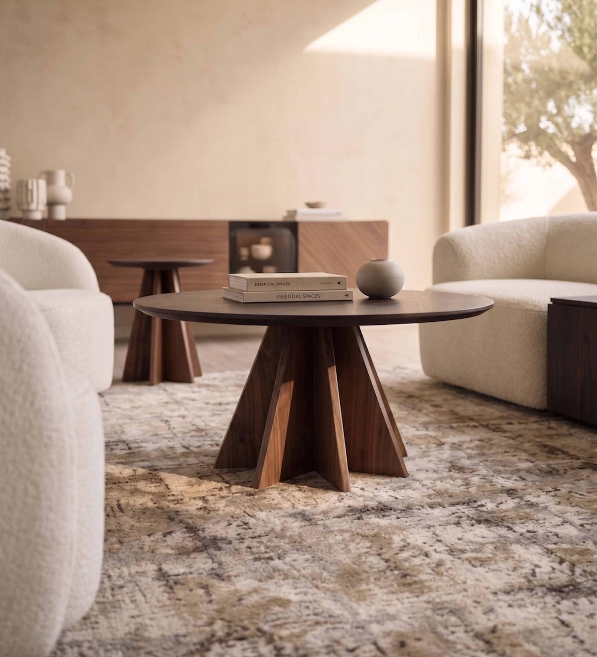 Lagos Center Table round walnut table with star-shaped pedestal base in living room