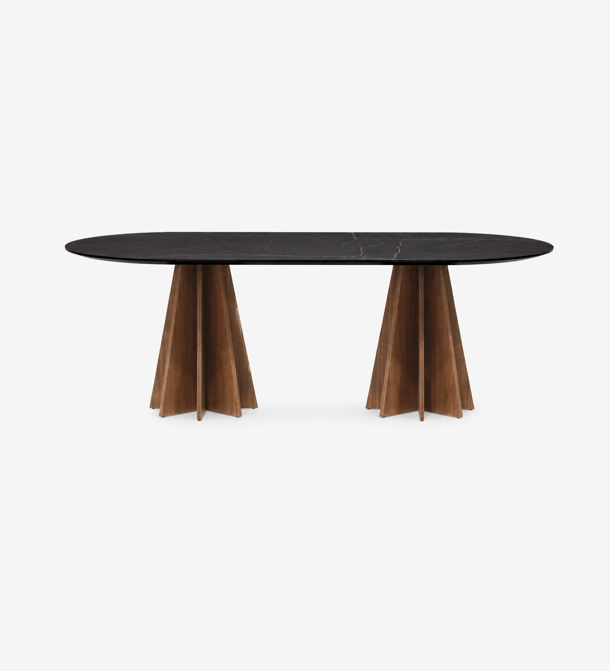 Lagos Dining Table with oval black marble top and twin sculpted wooden pedestal bases