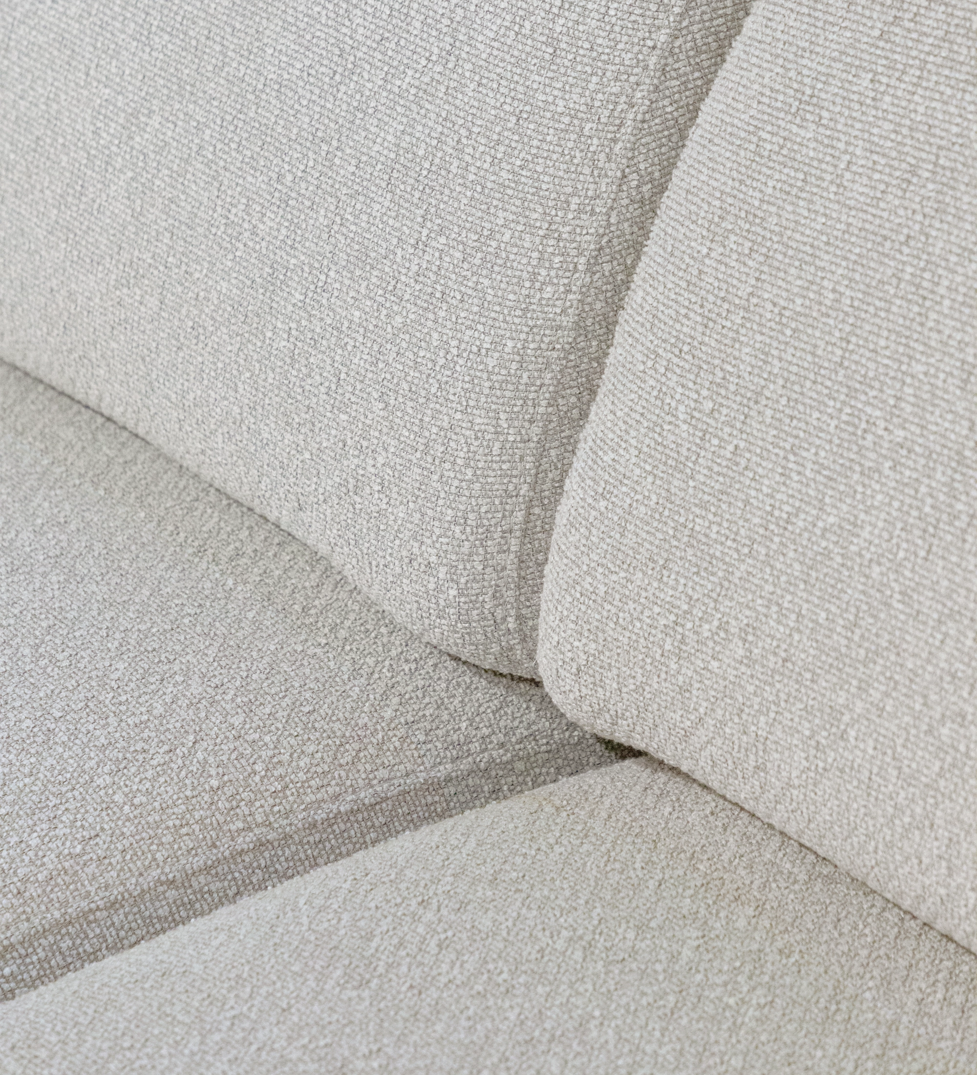 Close-up of beige textured cushions on Lagos Sofa with Chaise Longue