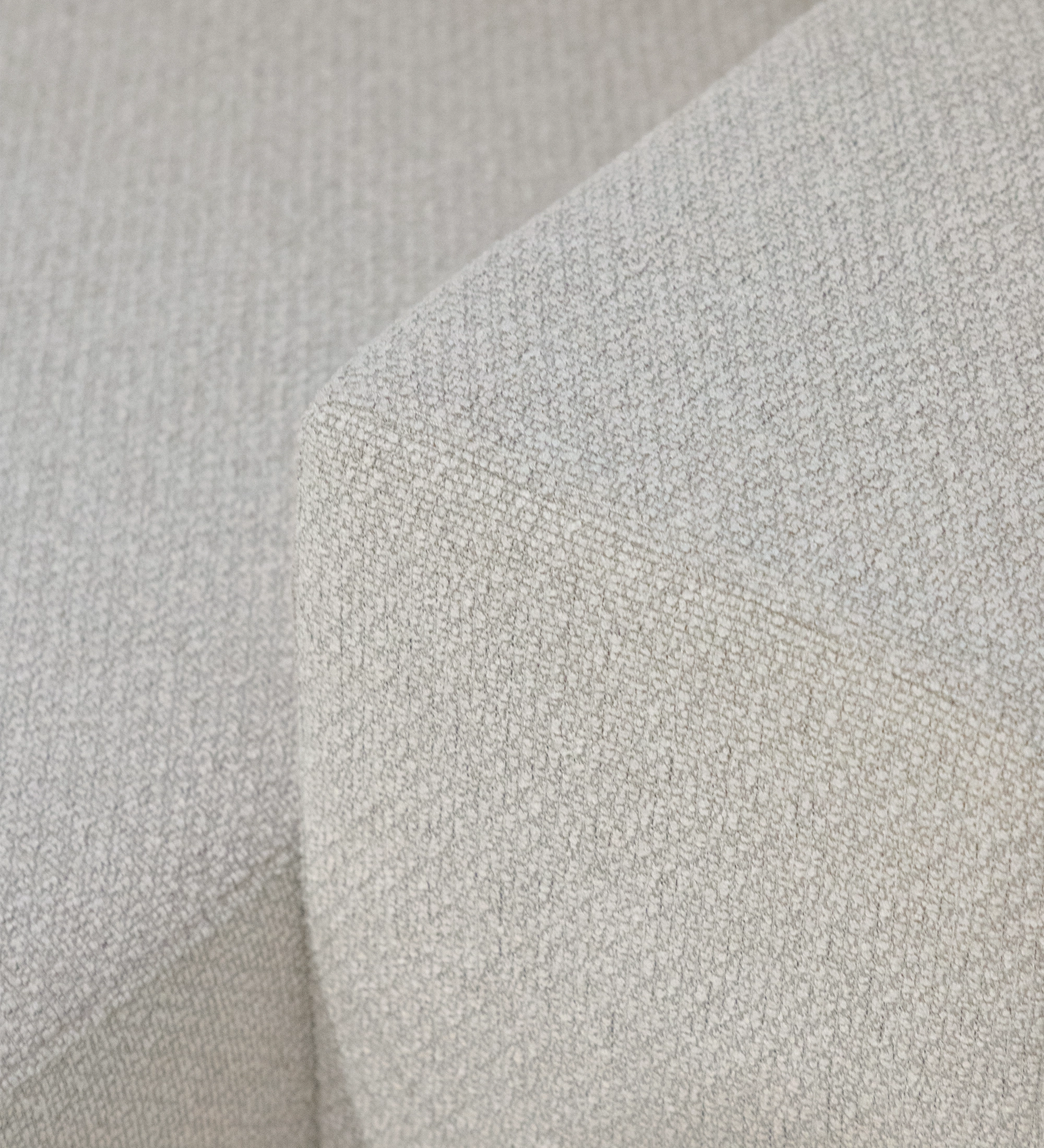 Close-up of beige textured upholstery on Lagos Sofa with Chaise Longue