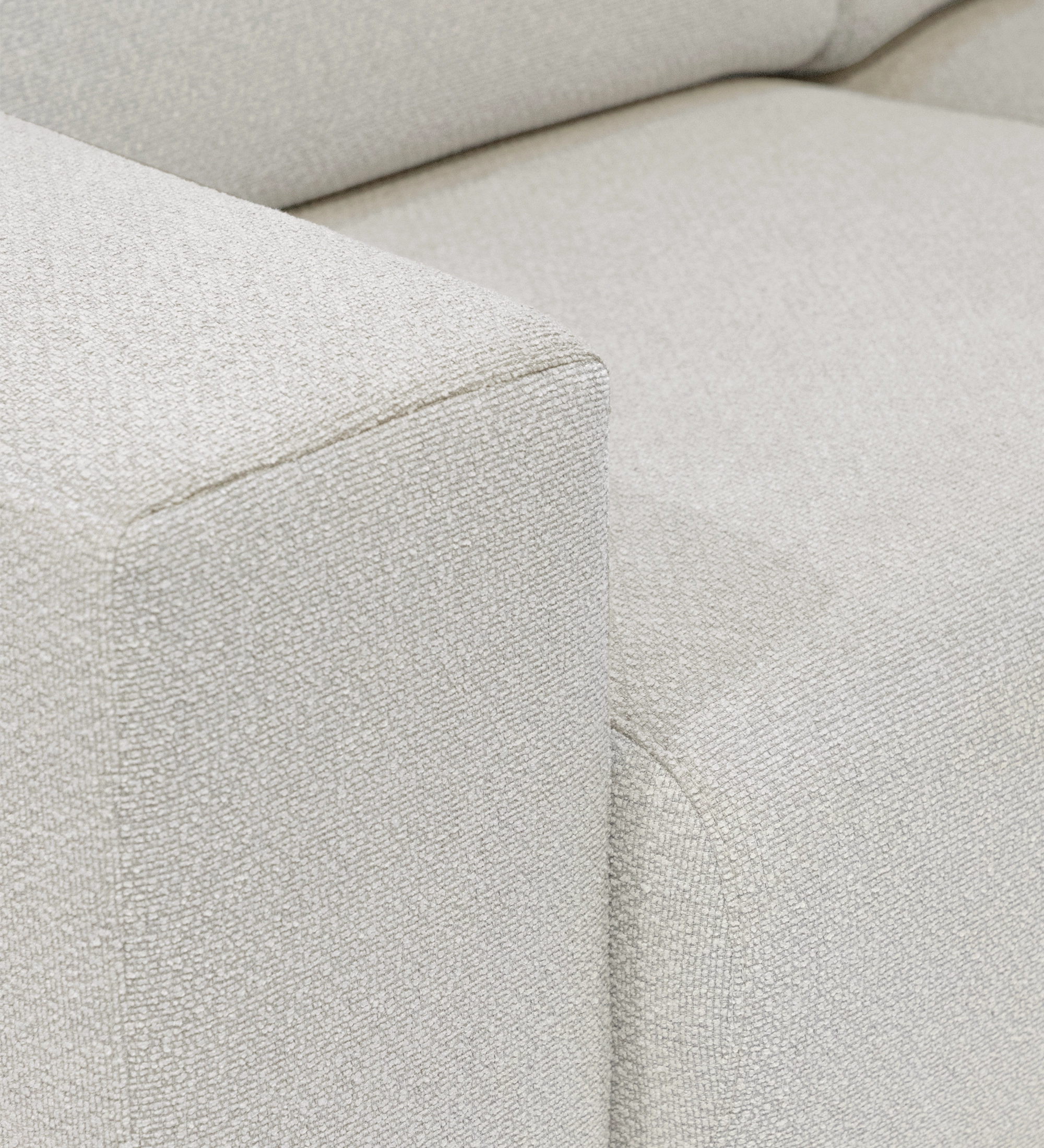 Lagos Sofa with Chaise Longue close-up of light beige textured fabric arm and seat