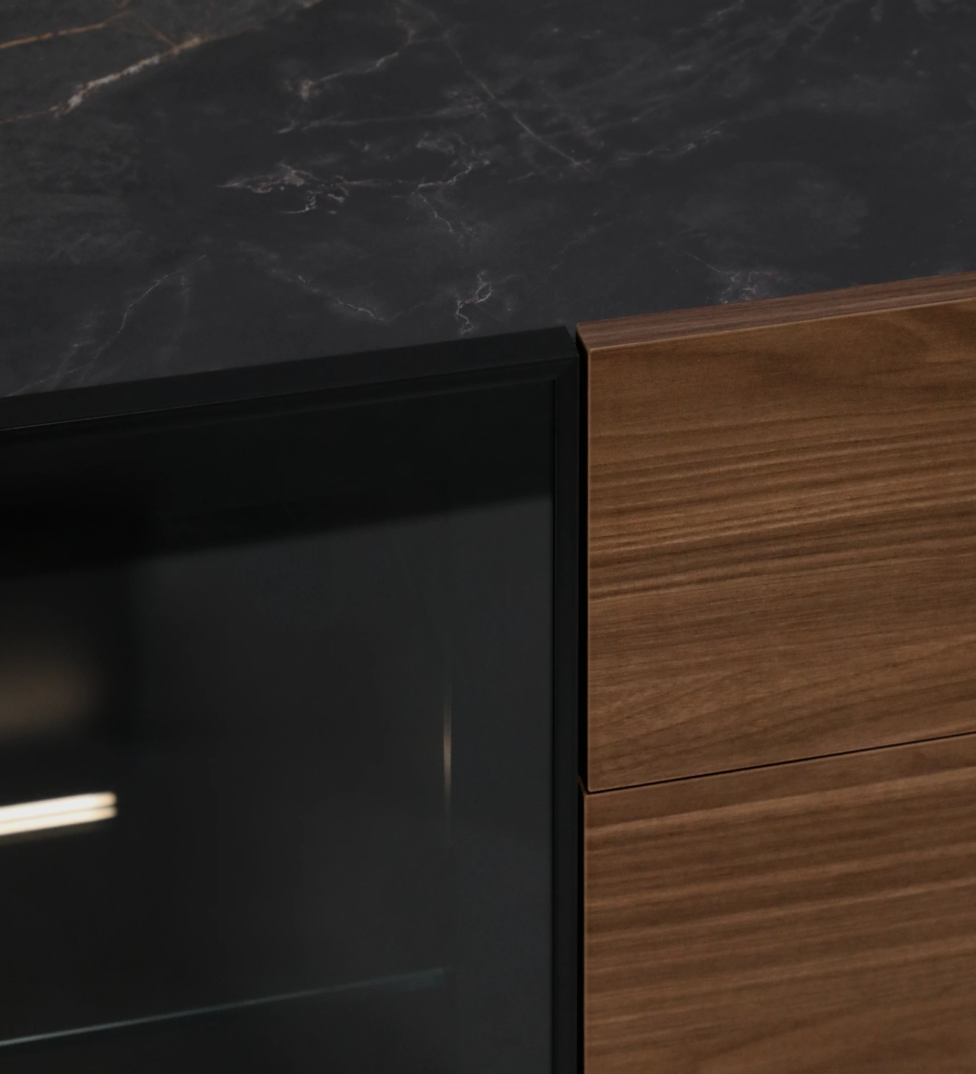 Lagos Sideboard close-up showing dark marble top, glass door and walnut drawers