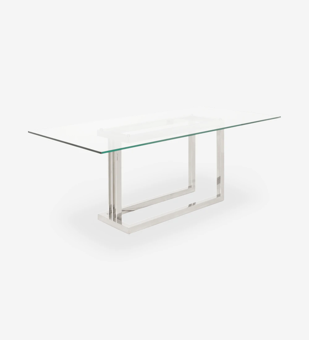 Table de repas rectangulaire avec plateau en verre et pied en acier inoxydable.
