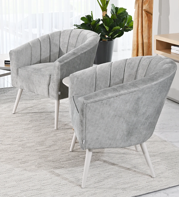 Tokyo armchair upholstered in gray fabric, pearl lacquered feet.