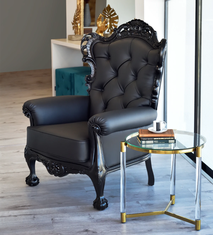 Paris armchair upholstered in black fabric, structure and feet lacquered in black.