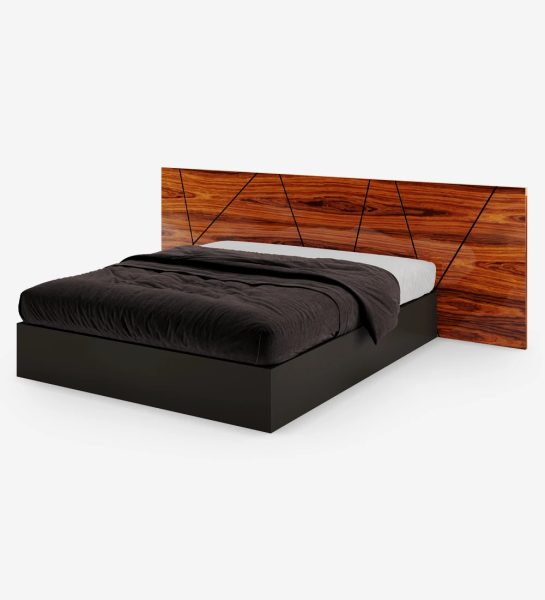 Double bed with abstract high gloss palissandro headboard and black base, with storage through a lifting platform.