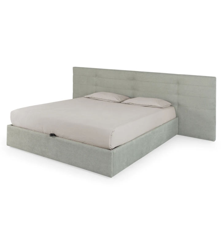 Cama doble con cabecero largo, tapizado en tejido, con almacenaje mediante somier elevable.