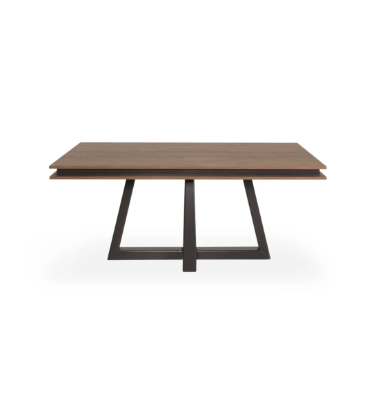 Mesa de comedor rectangular extensible con tablero de roble envejecido, pie central lacado en negro.