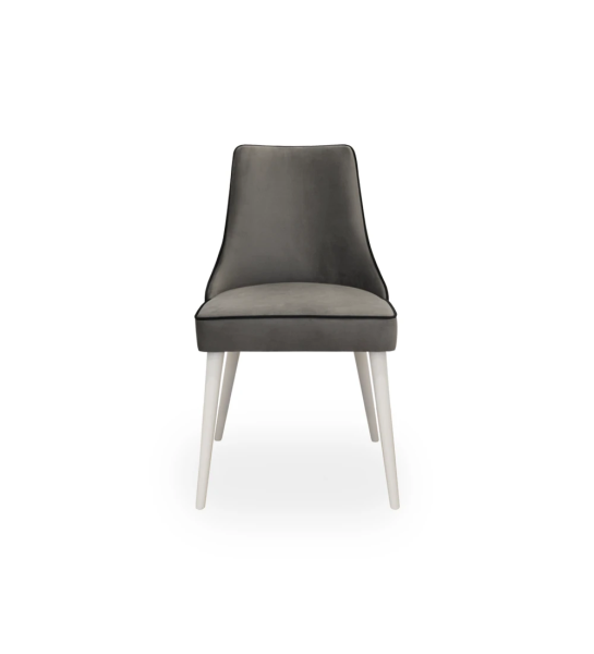Fabric upholstered chair with pearl lacquered feet.