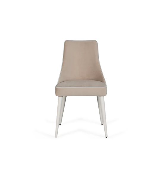 Fabric upholstered chair with pearl lacquered feet.