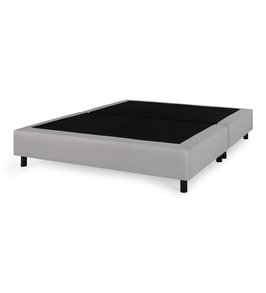 Simple double sommier, divided horizontally, upholstered in fabric.