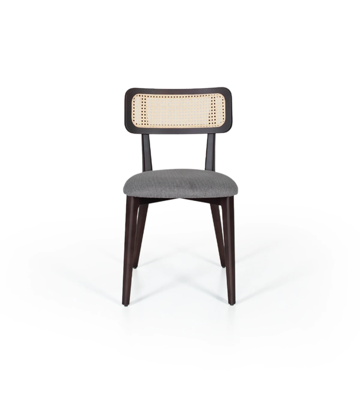 Wood chair, with rattan detail on the back and fabric upholstered seat.