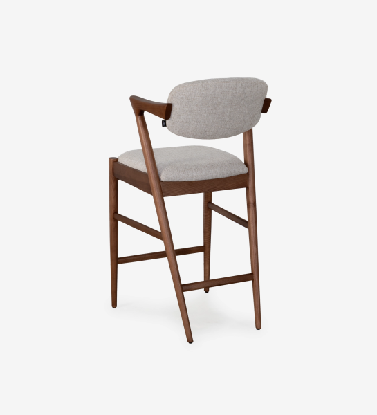 Stool in walnut-colored ash wood, with seat and back upholstered in gray fabric.