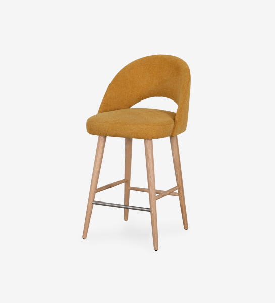 Stool upholstered in yellow fabric, with natural colored wooden legs.