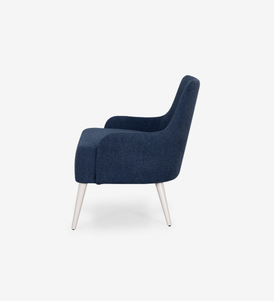 Oslo armchair upholstered in blue fabric, pearl lacquered feet.