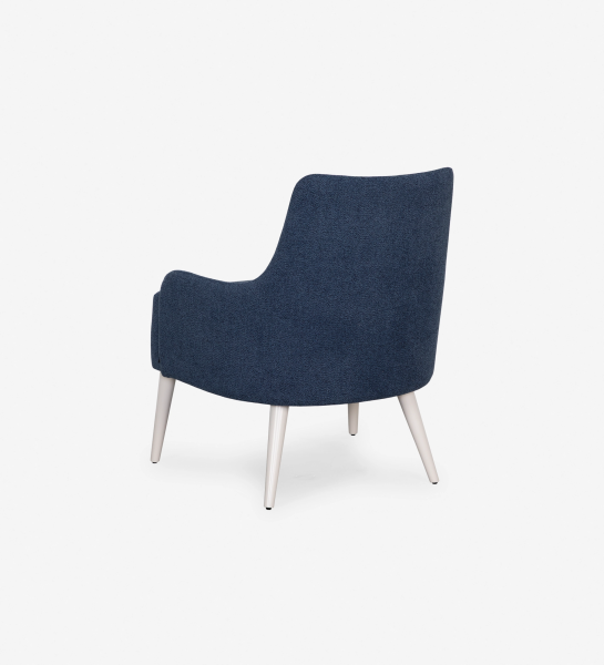 Oslo armchair upholstered in blue fabric, pearl lacquered feet.