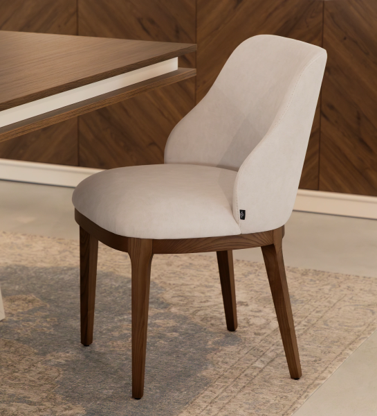 Cannes chair upholstered in beige fabric, legs in walnut-colored ash wood.