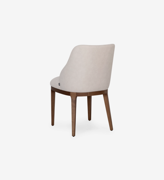 Cannes chair upholstered in beige fabric, legs in walnut-colored ash wood.