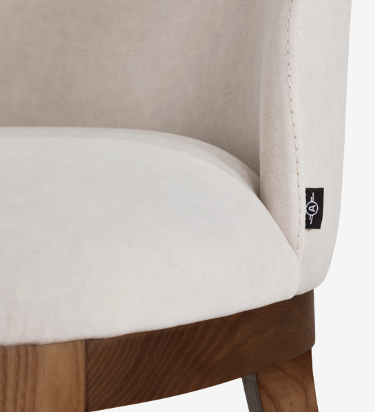 Cannes chair upholstered in beige fabric, legs in walnut-colored ash wood.