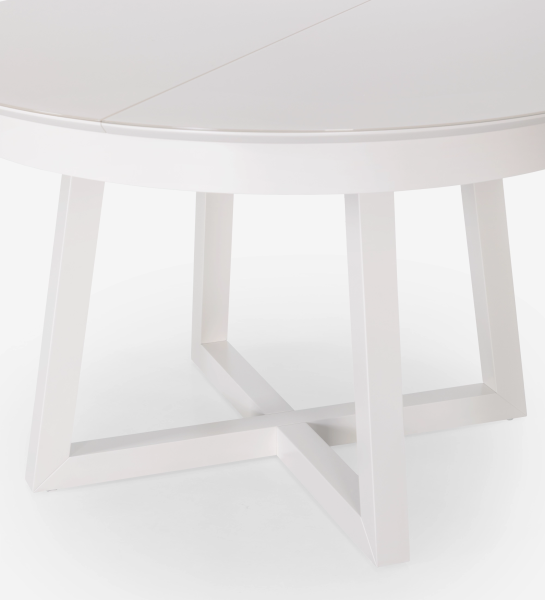 Mesa de comedor redonda extensible en lacado perla con tapa de cristal y extensión en lacado perla.