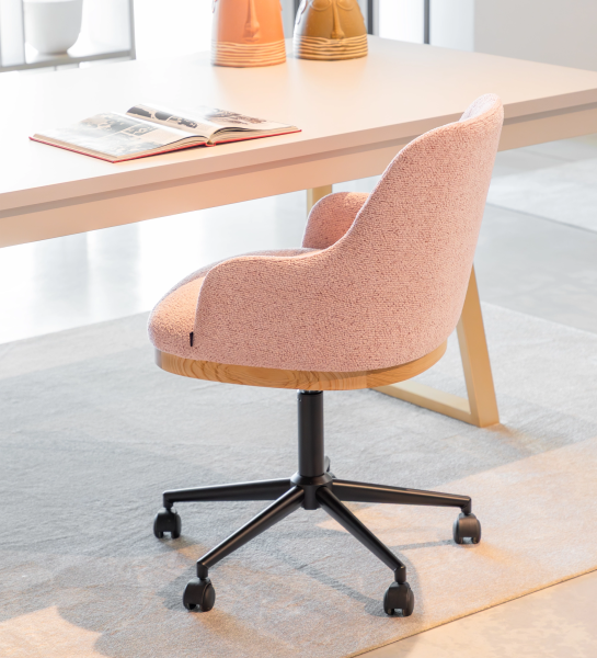 Swivel chair upholstered in pink fabric