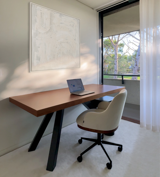 Cannes Executive Chair white upholstered swivel chair beside wooden desk in bright office