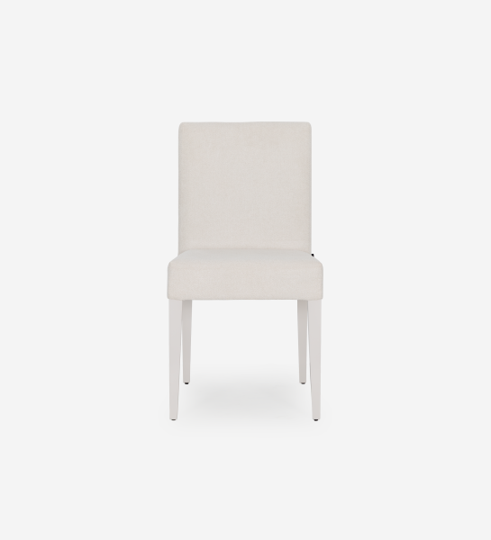 Chaise rembourrée en tissu, pieds laqués perle.